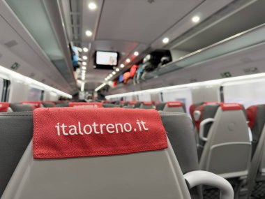 BOLOGNA, ITALY - OCTOBER 27, 2024: Interior of Italo Treno train in Italy with background blur clipart