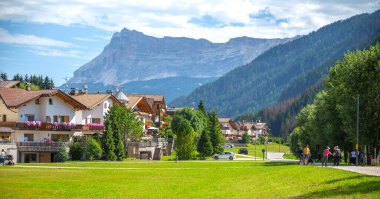 Dolomites, Italy---Aug 01, 2024: beautiful Corvara mountain town with Alpine mountain view clipart