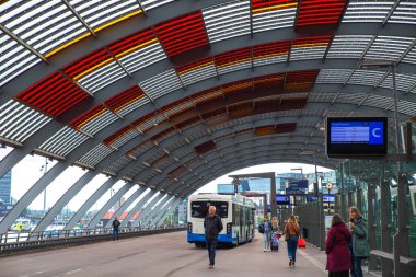 Amsterdam, Netherlands-Sep 22, 2023: The Amsterdam Central station bus station clipart