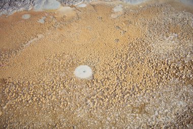 cones of mud volcanoes from which rivers of mud flow clipart