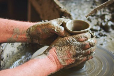 Potters hands atelier ceramic Marginea, Bukovin, Romania clipart