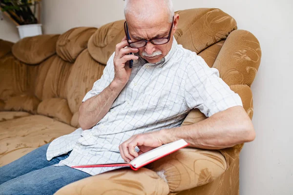 Elderly Man Talks Phone Writes Data Diary Glider Organization Business — Stock Photo, Image