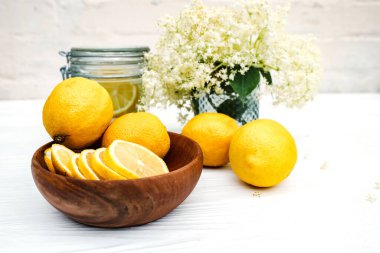 Canned drink with elderberry and lemon. A refreshing summer drink with fresh elderberry flowers.