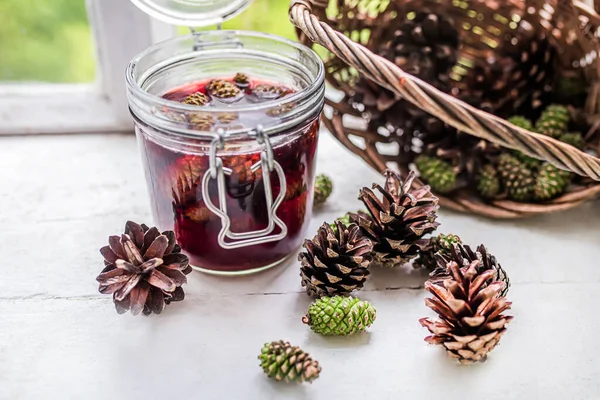 jar of pine cone jam, a reminder of the beauty and bounty of the forest, and a natural remedy for a sore throat