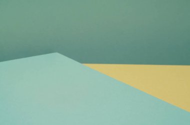 Yeşil ve sarı gölgeli kağıttan yapılmış renkli bir arka plan. Soyut geometrik