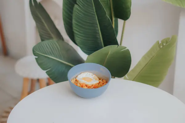 a cup of coffee and a spoon on a white background