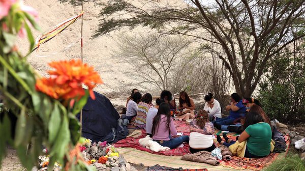 Circle of Women Meditating during a Holistic Session on a Mountain in Cieneguilla.
