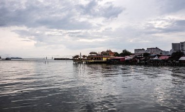 Village on water piles penang malaysia traditional asian houses photo clipart