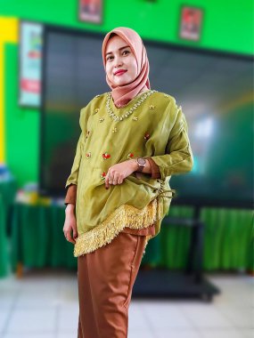 Portrait of a beautiful Asian woman wearing the traditional Bugis dress 