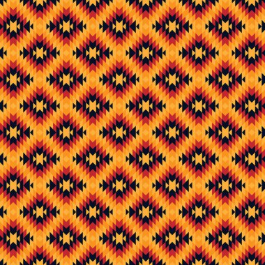 Elmas desenleri ve daha kompleks geometrik şekiller. Turuncu, kırmızı, sarı ve koyu mavi karışımı. Modern bir etnik ya da kabile motifi gibi görünüyor..