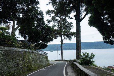 view on the edge of Lake Toba Soekarno's residence while in exile in Parapat, North Sumatra clipart