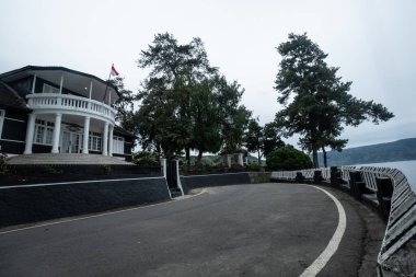 Medan, Indonesia November 29, 2024 : Historic House in Parapat City. Soekarno's residence (pasanggrahan bung karno) when he was exiled in North Sumatra. clipart