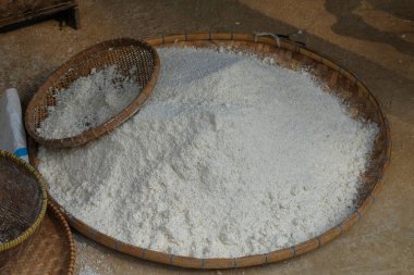 A pile of white cassava flour. cassava flour is an ingredient in making bread and other foods. Cassava flour factory