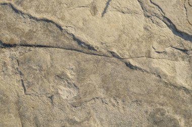 Soyut şekiller, kalıplar ve sert toprak dokuları kayalara benziyor. Sertleştirilmiş, yoğun çamur. Sert zemin yüzeyleri için desen. Grafik tasarımları veya afiş arkaplanı için. Doğal desen ve doku arkaplanı