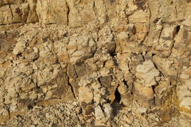 Soyut şekiller, kalıplar ve sert toprak dokuları kayalara benziyor. Sertleştirilmiş, yoğun çamur. Sert zemin yüzeyleri için desen. Grafik tasarımları veya afişler için. Dünya element kavramı