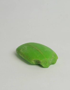 Closed up of damaged green bath soap. Abstract shape of bath soap. Bath soap is in bar form, not liquid clipart