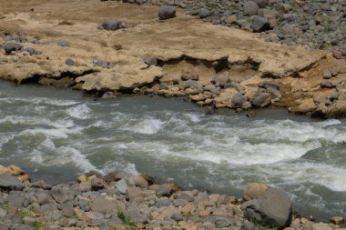 Clear river flow.View from the top of the river flow in the countryside clipart