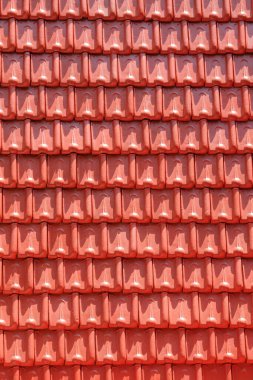 Soyut şekiller, desenler ve kırmızı kil çatı kiremitleri. Geleneksel Cavalılar, Endonezya 'nın çatı kiremitleri düzgünce dizilmiş. Grafik tasarımı veya afiş arkaplanı için