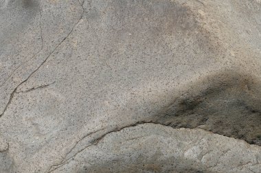 Gri taş yüzeyin soyut desen ve doku arkaplanı. Uzayı kopyala Doğal taştan arka plan. Grafik tasarımı veya afiş arkaplanı için