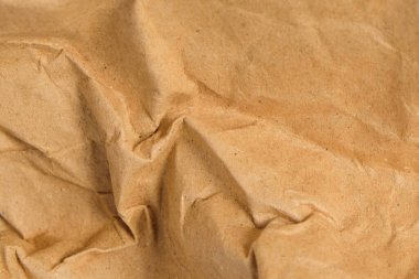 Buruşuk ve buruşuk kahverengi kağıt yüzey tekülü arka plan. Doğal soyut model ve tekstil. Grafik tasarımı veya afiş arkaplanı için.