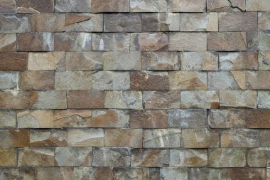 Arkaplan deseni ve duvar dokusu düzgün bir taş diziliminden. Doğal taş kare şeklinde oluşmuş. Uzayı kopyala Grafik tasarımı için, 3 boyutlu biçimlendirme veya pankart arkaplanı