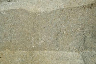 Gri renkli katmanlı engebeli kaya yüzeyinin arka plan dokusu. Grafik tasarımı için, 3B görüntüleme ve pankart arkaplanı