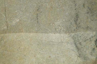 Gri renkli katmanlı engebeli kaya yüzeyinin arka plan dokusu. Grafik tasarımı için, 3B görüntüleme ve pankart arkaplanı