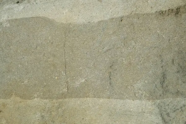 Gri renkli katmanlı engebeli kaya yüzeyinin arka plan dokusu. Grafik tasarımı için, 3B görüntüleme ve pankart arkaplanı