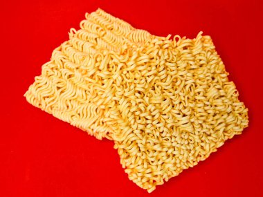 Dry instant noodles are raw noodles made from wheat flour, eggs, preservatives. egg noodles with isolated background, instant fast food concept. clipart