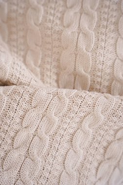 Beyaz desenli beyaz örülü battaniye. Geçmişi. doku.