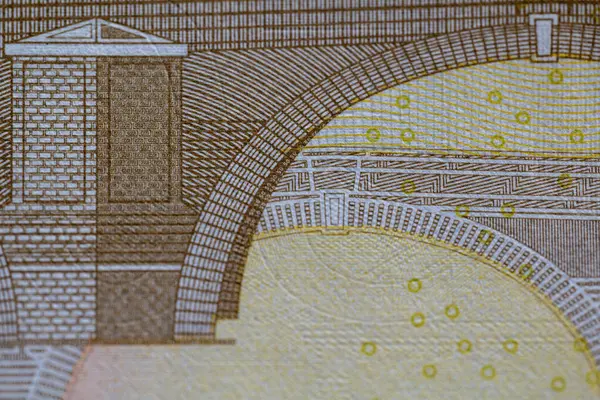 Euro Banknote 'un Macro Shot' u. Bir Euro banknotunun karmaşık detaylarını vurgulayan, tasarım ve güvenlik özelliklerine odaklanan bir makro çekim.