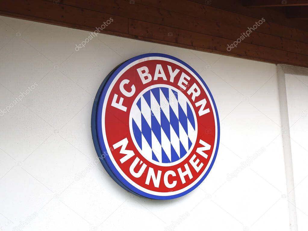 29.05.2025 Germany: The emblem of FC Bayern Munich is prominently displayed on a white wall, symbolizing the renowned football club. The design incorporates the clubs official colors and distinctive