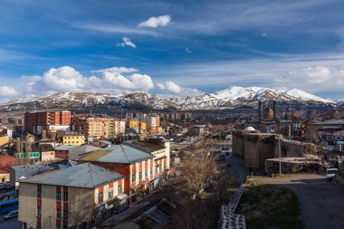 The cityscape and Chifte Minare and Mount Palandken seen from Erzurum Castle in Erzurum, Turkey clipart