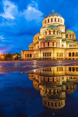 The Alexander Nevsky Cathedral illuminated in a puddle in Sofia, Bulgaria clipart