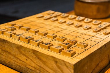 Wooden shogi board and pieces clipart