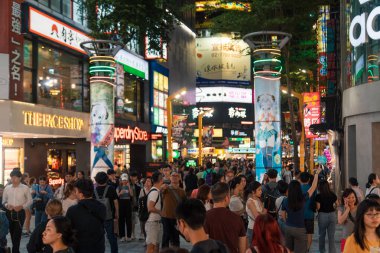 Taipei, Taiwan - October 10th 2019: Vibrant night life in Taipei bustling with energy and diverse crowds of people clipart