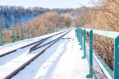 Winter landscape, old railway bridge in Czech Republic, Moldava. High quality photo clipart