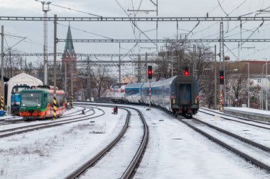 Teplice, Czech Republic, Jahuary 7, 2025. Local railway station. The tain leavesthe station. High quality photo clipart