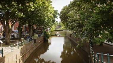 Greetsiel, Germany - May 24, 2023: Idyllic Harbor of Greetsiel, a small picturesque fishing town and tourist attraction in North Frisia shortly before summer season starts.  clipart