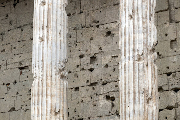 Detail of the Corinthian columns of the Temple of Hadrian in Rome, Italy