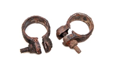 The old rusty sleeve with completely hardened threads, overgrown by rust. There was a need to cut it in halves. Isolated in a white background.