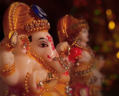 Lord Ganesh with bokeh abstract lights. Vinayaka sculpture for Ganesh Chaturthi. Ganapathi is the most workshipped God in Indian culture. Elephant faced God of the Indian culture who is loved by all and is considered the remover of obstacles.