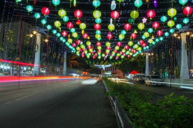 Indonesia, Solo. - January 1,2000: Beautiful colorful lantern decorations at night installed on the Pasar Gede bridge clipart