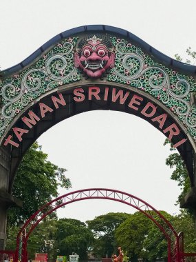 Indonesia, Solo - December 12, 2024: the entrance gate to Sriwedari Park, inside there are old buildings and several deer, located in the city of Solo clipart