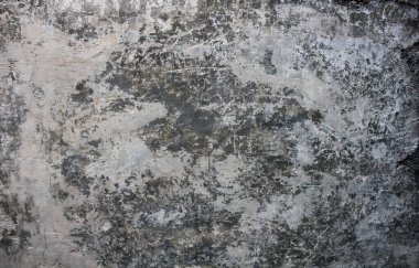 Küçük çatlaklarla ve soluk beyaz renklerle dolu aşınmış beton duvarın arka planı