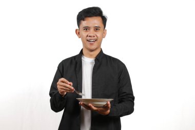 Genç Yetişkin Adam Tabak ve Kaşık Yemeye Hazır