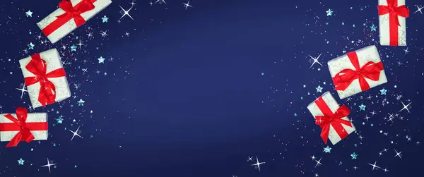 Mavi arka planda Noel süsleri ve hediye, üst manzara.