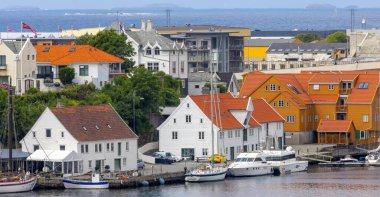 Haugesund Norway scandinavia, Colorful village scene Norway with various boats clipart