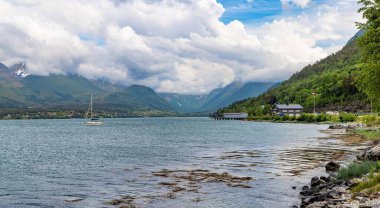 Andalsnes, Norway. Beautiful views of mountains, colorful cities and cruise ships in the arctic circle of Norway clipart