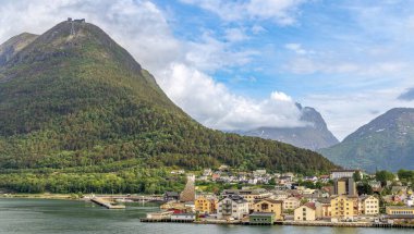 Andalsnes, Norway. Beautiful views of mountains, colorful cities and cruise ships in the arctic circle of Norway clipart